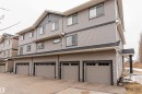 Multi-level exterior with horizontal siding and dark trim accents - 6 12815 Cumber Nw, Edmonton, AB 