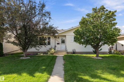 Single-story residence featuring white siding and a front entry - 13304 73 Street Nw, Edmonton, AB 