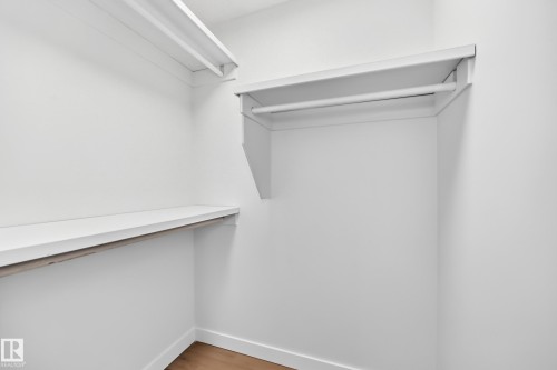 White shelving units and a hanging rod - 3924 26A Avenue Nw, Edmonton, AB 