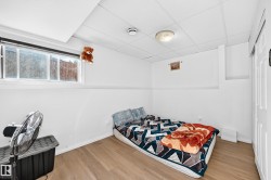Recessed window, wood-finish flooring, white walls, drop ceiling, flush-mount ceiling light - 