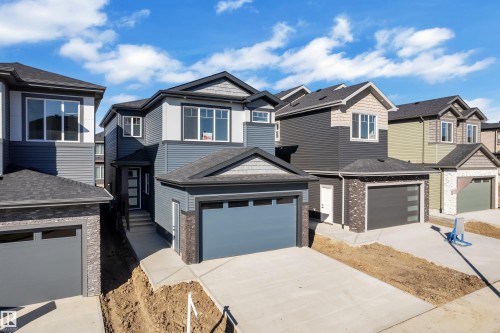 Modern two-story exterior with dark siding and light trim - 3604 44 Avenue, Beaumont, AB 