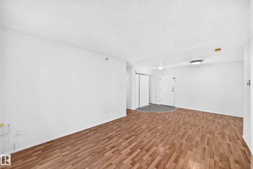 Recessed lighting, wood-finish flooring, white walls, and a white ceiling - #212 11218 80 St Nw, Edmonton, AB 