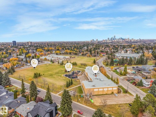 Aerial perspective featuring proximity to urban skyline, expansive green space, mature tree canopy, and established neighborhood infrastructure - 9617 151 Street Nw, Edmonton, AB 
