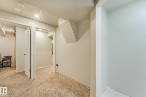 Neutral-toned interior space featuring recessed lighting, multi-panel doors, and carpeting - 9617 151 Street Nw, Edmonton, AB 