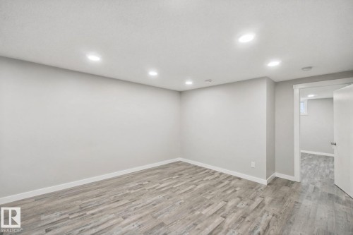 Recessed ceiling lighting, light gray wall paint, white trim, wood-finish flooring - 13212 73 Street Nw, Edmonton, AB 