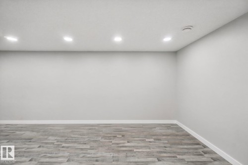 Recessed ceiling lighting with wood-finish flooring - 13212 73 Street Nw, Edmonton, AB 