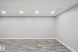 Recessed ceiling lighting with wood-finish flooring - 