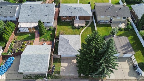 Detached garage with two roll-up doors and a concrete driveway - 13212 73 Street Nw, Edmonton, AB 