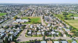 Residential area with extensive green spaces and paved roadways - 