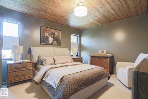 Wood-paneled ceiling, recessed lighting, wall-to-wall carpeting, and multiple windows - 2 Hillview Crescent, Sherwood Park, AB 