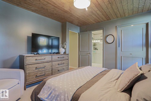 Wood-finish ceiling with a flush-mount light fixture - 2 Hillview Crescent, Sherwood Park, AB 
