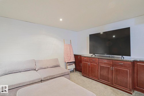 Built-in cabinetry with dark wood finish and stone countertop - 2 Hillview Crescent, Sherwood Park, AB 