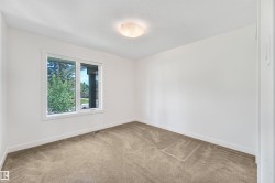 Neutral wall paint, plush carpet flooring, recessed window, and flush-mount ceiling light - 