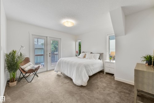 Light-colored carpeting, white walls, and a ceiling-mounted light fixture - 8212 148 Street Nw, Edmonton, AB 