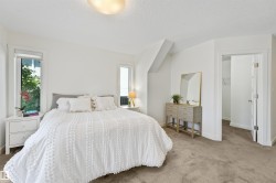 White walls with window trim, neutral carpet flooring, recessed window, and ceiling light fixture - 
