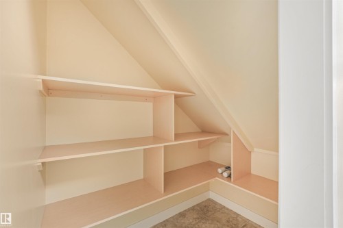 Built-in shelving with light-toned wood construction - 8212 148 Street Nw, Edmonton, AB 