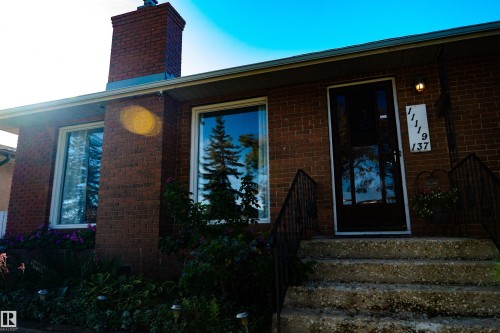 Brick exterior with a prominent brick chimney - 11119 137 Avenue Nw, Edmonton, AB 