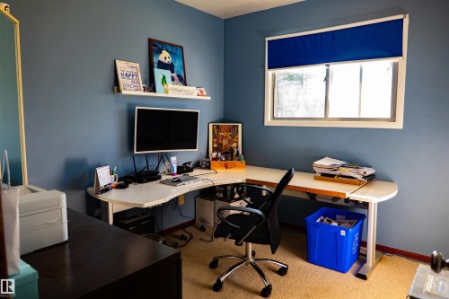 Wall-mounted shelving unit over a desk area - 11119 137 Avenue Nw, Edmonton, AB 