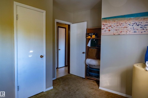 Carpeted flooring extending through the space - 11119 137 Avenue Nw, Edmonton, AB 