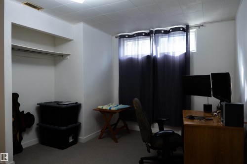 Recessed closet with shelving and hanging rod - 11119 137 Avenue Nw, Edmonton, AB 