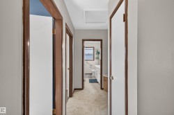 Tile flooring, white walls, and wood-finish trim - 