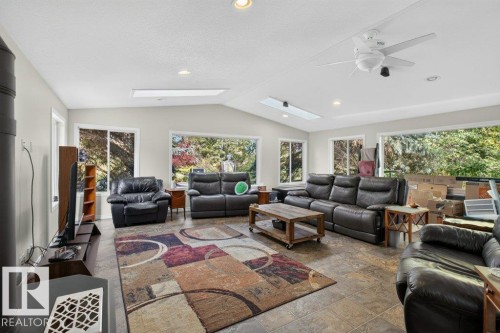 Vaulted ceiling with recessed lighting, skylights, and a ceiling fan - #74 22555 Twp Road 530, Rural Strathcona County, AB 