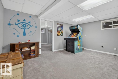 Carpeted flooring, drop ceiling, recessed lighting, and wall-mounted windows - #74 22555 Twp Road 530, Rural Strathcona County, AB 