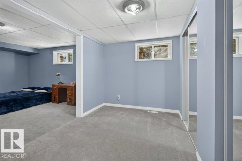 Carpeted flooring, recessed lighting, and multiple windows - #74 22555 Twp Road 530, Rural Strathcona County, AB 