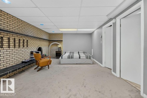 Brick accent wall with an arched alcove and fireplace - #74 22555 Twp Road 530, Rural Strathcona County, AB 