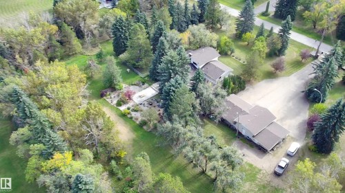 Extensive property featuring multiple structures, mature trees, and landscaped grounds - #74 22555 Twp Road 530, Rural Strathcona County, AB 