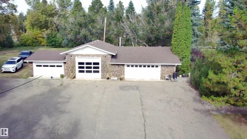 Brick-clad exterior with white gables and a brown shingle roof - #74 22555 Twp Road 530, Rural Strathcona County, AB 