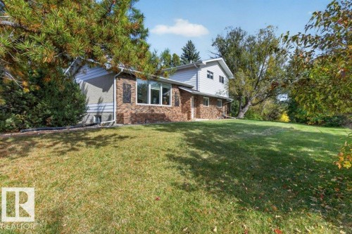 Brick and siding exterior with multiple windows - #74 22555 Twp Road 530, Rural Strathcona County, AB 