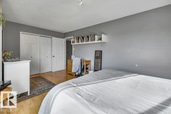 Hardwood-finish flooring, built-in shelving, and bi-fold closet doors - 
