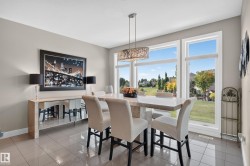 Tile flooring, recessed lighting, and a contemporary chandelier - 