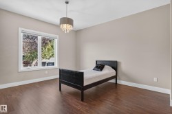 Wood-finish flooring, white trim, and neutral wall tones - 