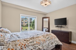 Hardwood-style flooring, neutral wall tones, and overhead lighting - 