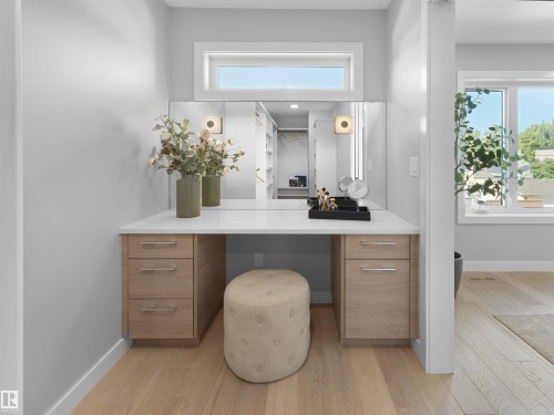 Built-in vanity with light wood-finish cabinetry, white countertop, and wall-mounted mirrors - 9118 89 Street Nw, Edmonton, AB 