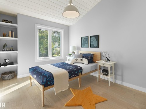 Wood-finish flooring, built-in shelving, white trim window, painted ceiling, and a ceiling-mounted light fixture - 9118 89 Street Nw, Edmonton, AB 