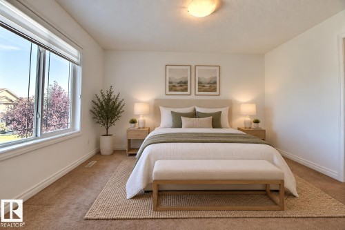 Expansive window with roller blinds, recessed ceiling light fixture, and neutral wall paint - 5205 168 Avenue Nw, Edmonton, AB 