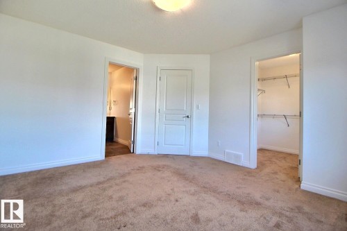 Plush carpeting throughout, bright white walls, and a recessed ceiling light - 5205 168 Avenue Nw, Edmonton, AB 