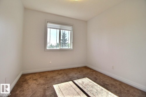 Neutral wall color throughout, offering a versatile canvas - 5205 168 Avenue Nw, Edmonton, AB 