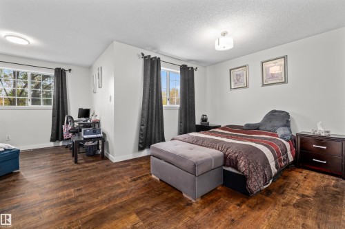 Wood-finish flooring, two window units, and two ceiling-mounted light fixtures - #63 501 Youville Dr E Nw, Edmonton, AB 