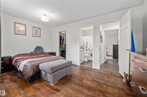 Wood-finish flooring throughout, bright white walls, and a recessed ceiling light - #63 501 Youville Dr E Nw, Edmonton, AB 