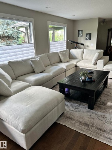 Recessed ceiling lighting, wood-finish flooring, two large windows, and neutral wall paint - 22245 Twp Road 512, Rural Strathcona County, AB 