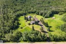 Expansive property featuring dense wooded areas and open green spaces - 22245 Twp Road 512, Rural Strathcona County, AB 