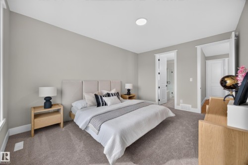 Plush carpeting, recessed ceiling lighting, and multiple doorways with contrasting trim - 209 Hampshire, Sherwood Park, AB 