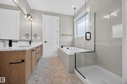 Dual vanity with wood-finish cabinetry, white countertops, and matte black fixtures - 