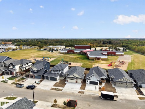 New construction residential properties with concrete driveways and attached garages - 209 Hampshire, Sherwood Park, AB 