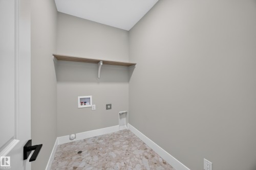 Wood-finish shelving with white support brackets - 209 Hampshire, Sherwood Park, AB 