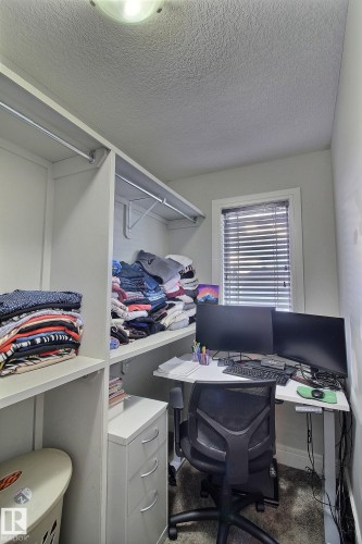Built-in shelving and closet rods provide organization - 35 Hudson Cove, Spruce Grove, AB 